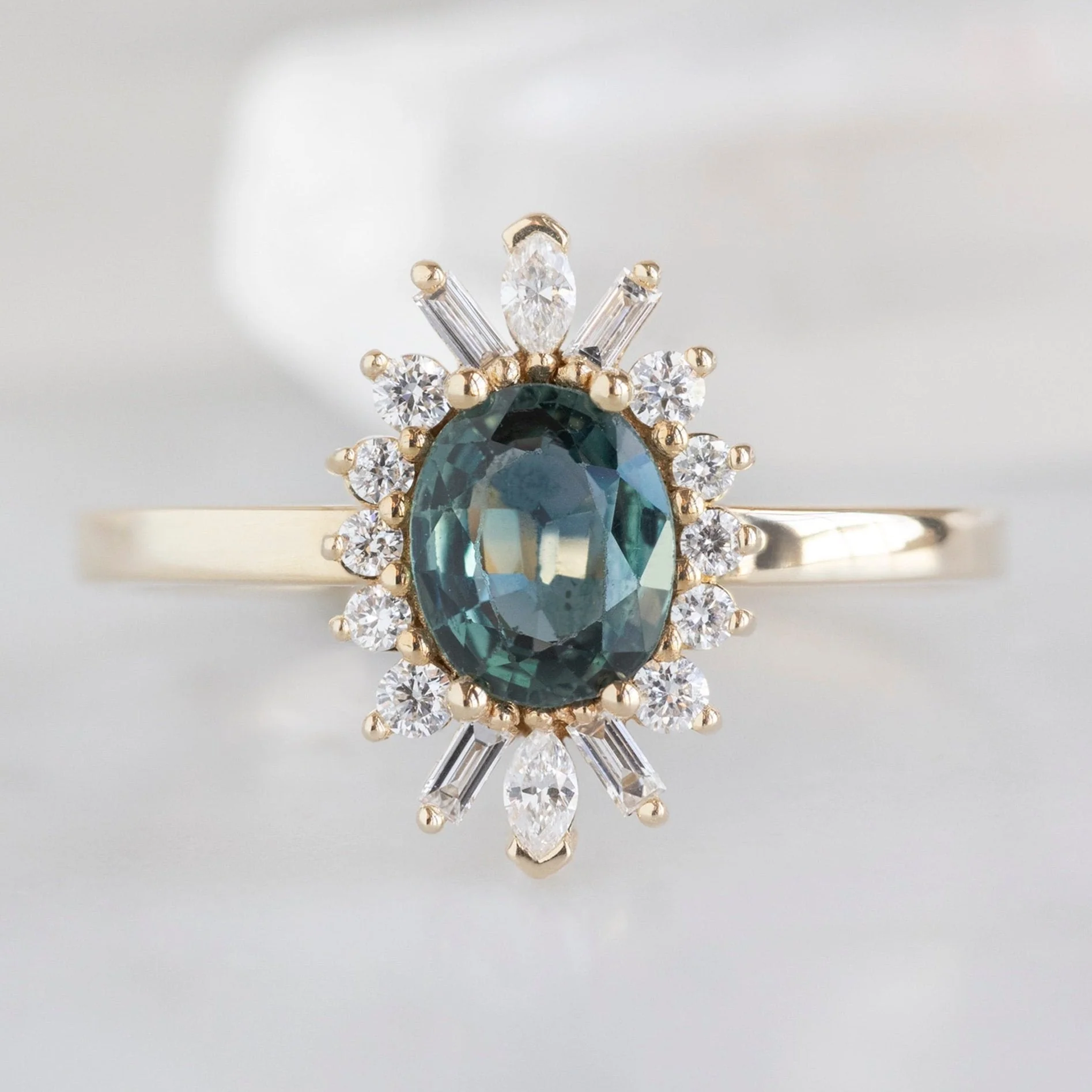 The Camellia Ring | 0.72ct Oval Blue Sapphire in 14K Yellow Gold